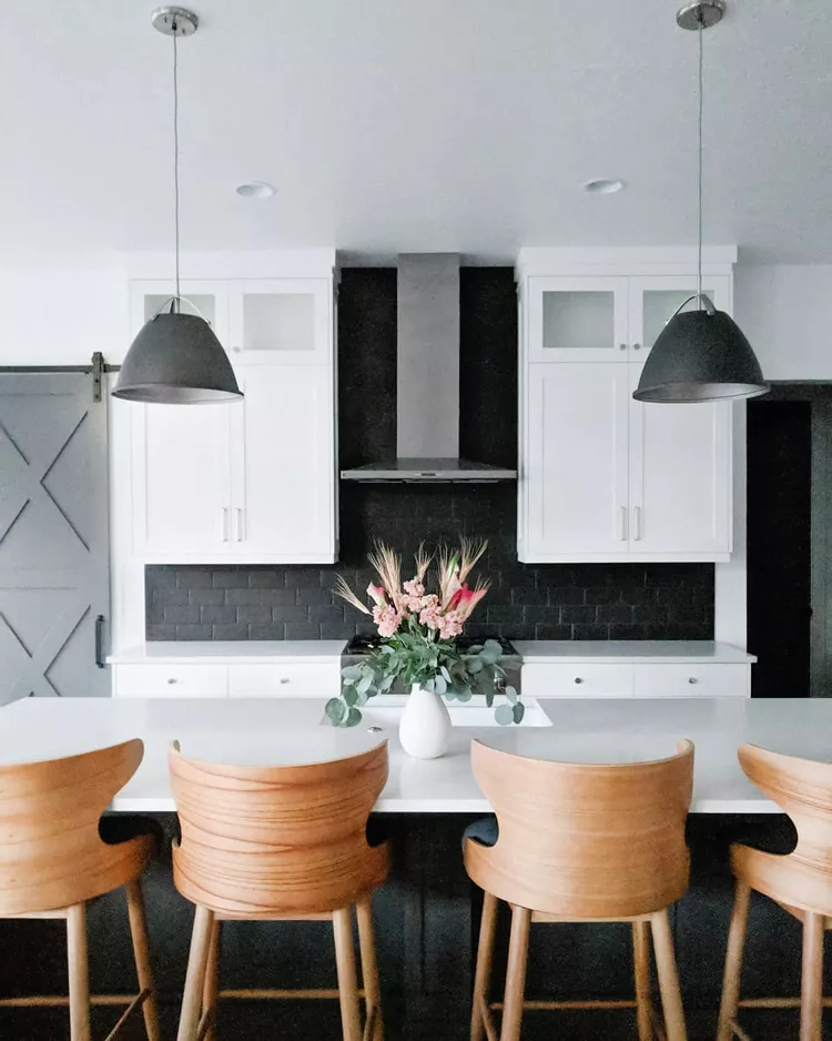 Black backsplash white kitchen cabinets